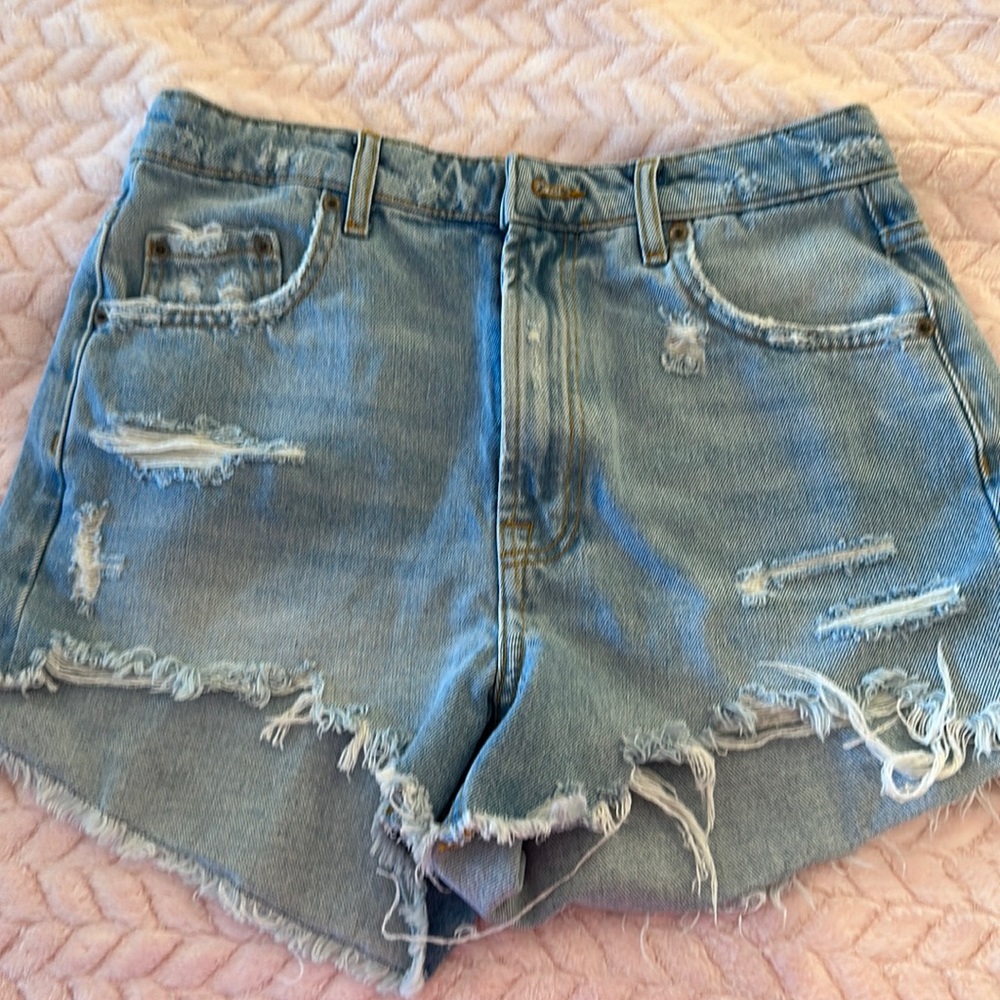 Blue zara jean shorts with some rips